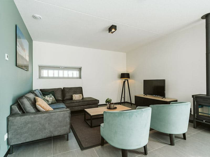 Impressie van de woonkamer in het vakantiehuis Luxe voor 10 personen, op Ridderstee Ouddorp Duin